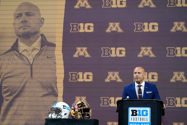 Minnesota head coach P.J. Fleck talks to reporters during an NCAA college football news conference at the Big Ten Conference media days, at Lucas Oil 