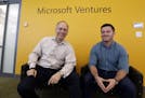 In this May 4, 2015 photo, Mark Hirsch, owner of Creative Worx, left, and Dan Bloom, owner of Slope, pose for photos in the offices of Microsoft Ventu