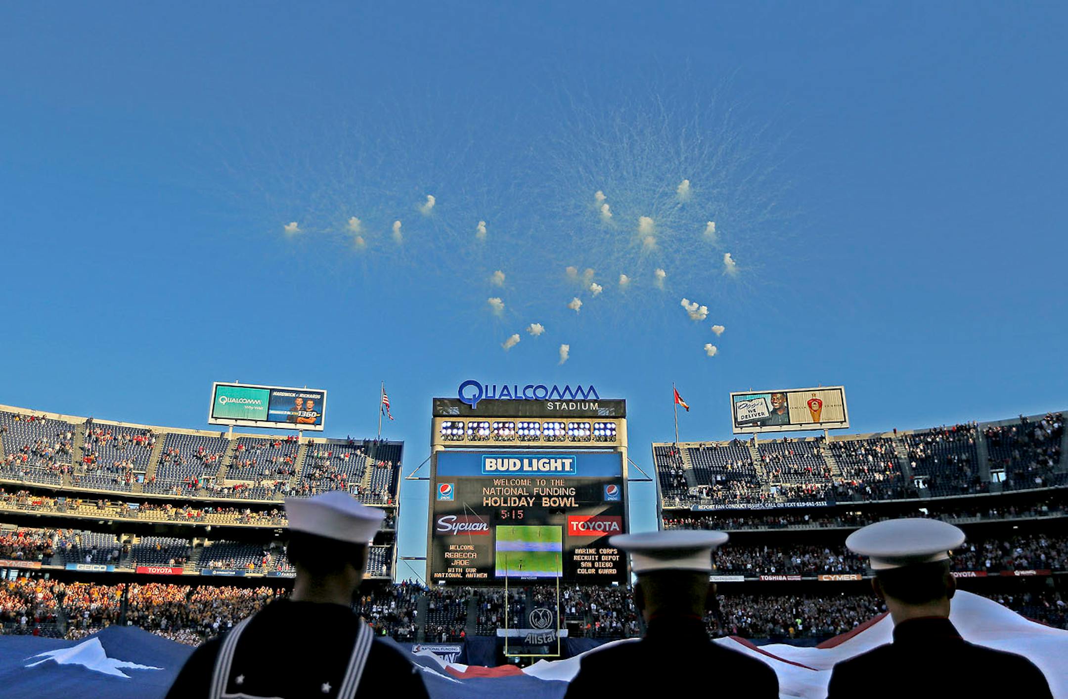 Local military carried the American Flag during the National Anthem before Minnesota took on Washington State at Qualcomm Stadium for the San Diego Holiday Bowl, Tuesday, December 27, 2016 in San Diego, CA.