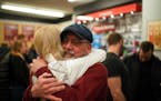 Anne Berg gave Penn Cycle owner Pat Sorensen a hug on Monday. Berg's dad bought her first bicycle, a green Schwinn English racer, at the shop and the 