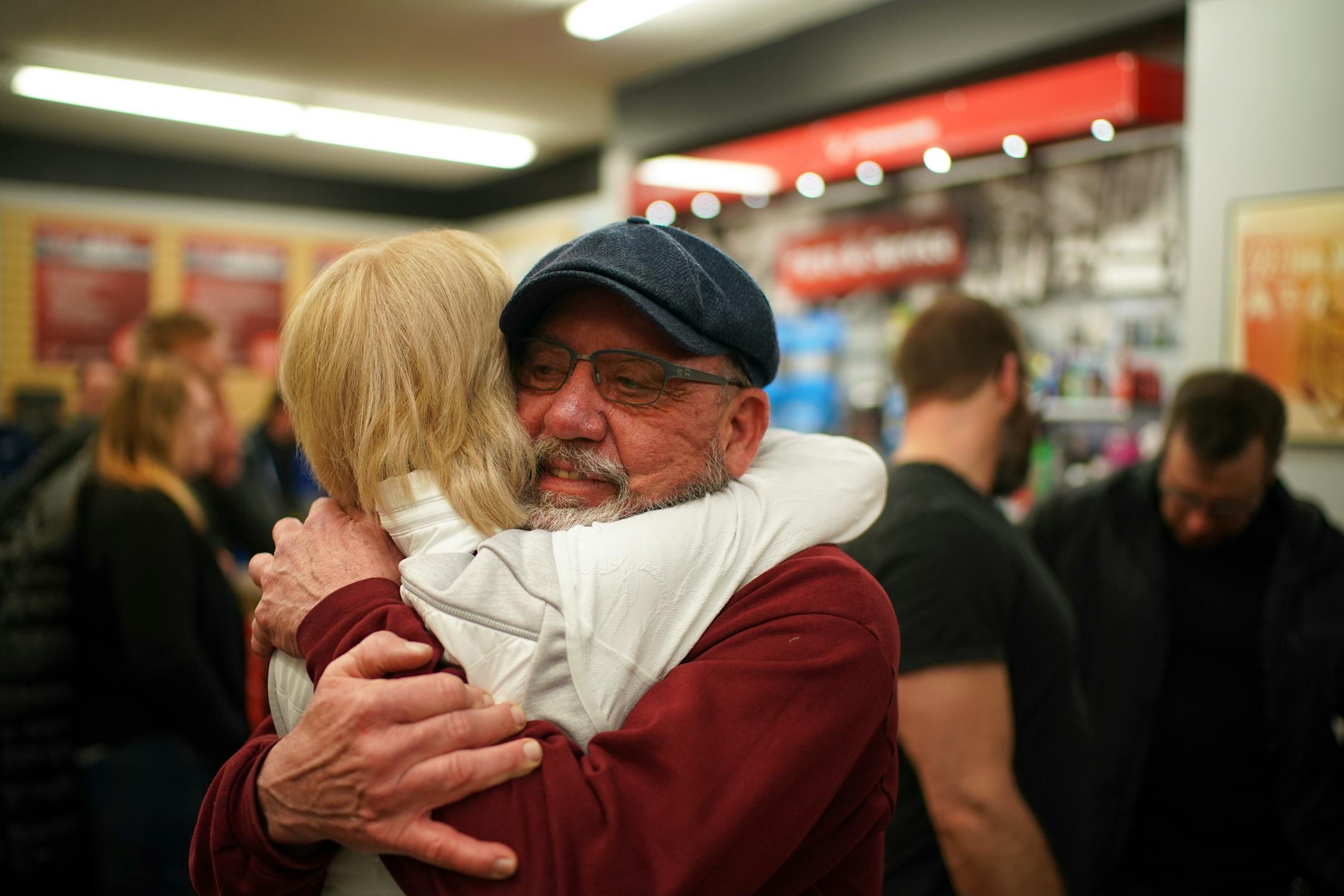 Anne Berg gave Penn Cycle owner Pat Sorensen a hug on Monday. Berg's dad bought her first bicycle, a green Schwinn English racer, at the shop and the families went on to become friends.