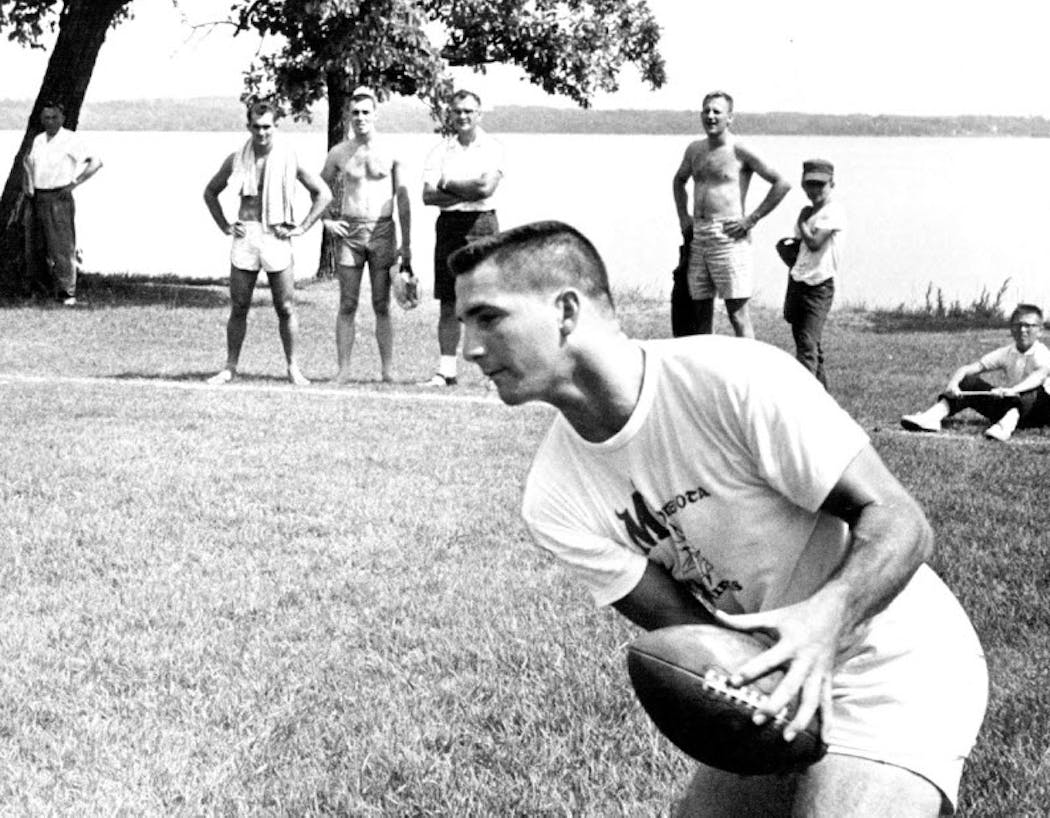 With Lake Bemidji in the background, Ed Leahy caught a pass during training camp in 1961.