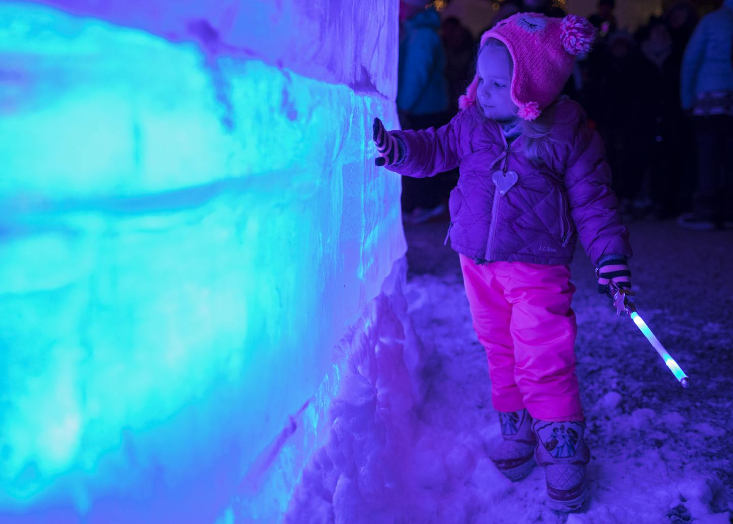 Hailey Miller, 2, who lives in New York City and was visiting family in town, ran her hand along the ice of the side of the ice palace at the lighting of the 2018 Winter Carnival Ice Palace in Rice Park on Thursday, January 25, 2018 in St. Paul, Minn. ] RENEE JONES SCHNEIDER &#x2022; renee.jones@startribune.com