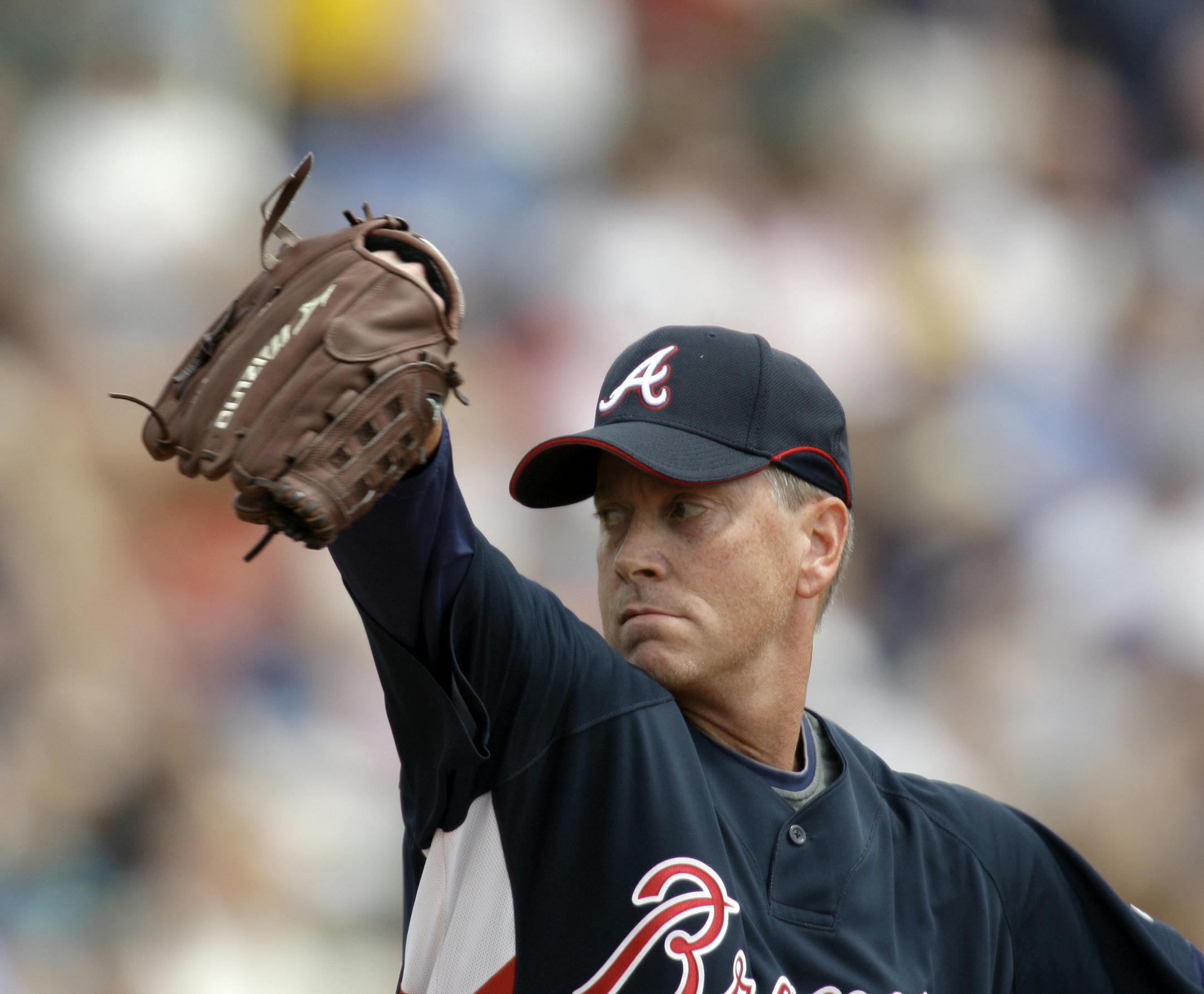 Atlanta Braves pitcher Tom Glavine throws to a New York Mets batter during a spring training baseball game, Saturday, March 21, 2009, in Kissimmee, Fla. (AP Photo/Rob Carr) ORG XMIT: OTKRC125