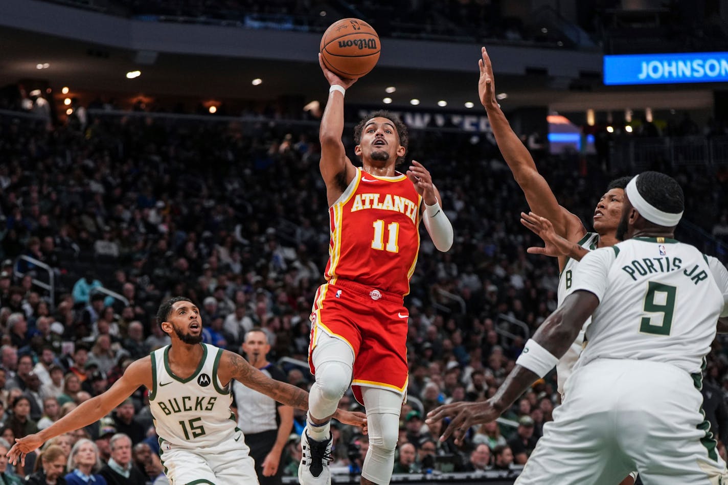 Atlanta Hawks' Trae Young jumps to make a basket during the first half of an NBA basketball game Sunday, Oct. 29, 2023, in Milwaukee. (AP Photo/Kenny Yoo)