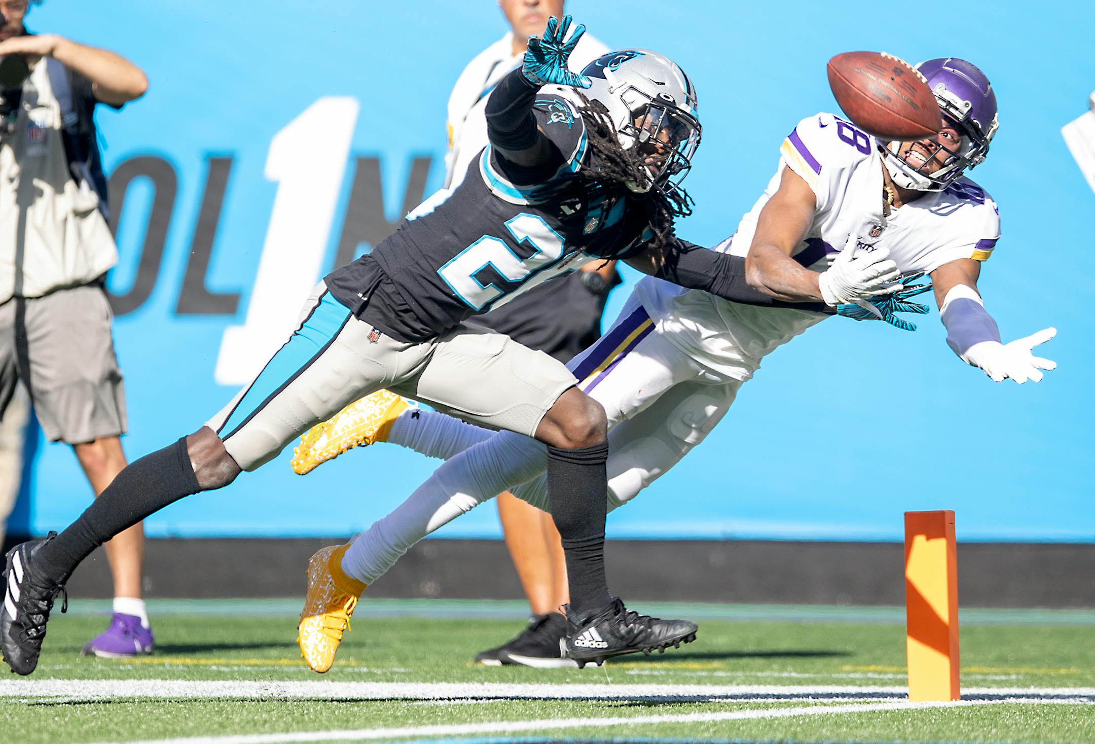 Vikings wide receiver Justin Jefferson (18) battled for the ball near the pylon with Panthers cornerback Donte Jackson (26) during the fourth quarter, Sunday, October 17, 2021 in Charlotte.