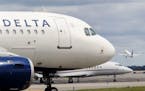 FILE - In this Aug. 8, 2017, file photo, a Delta Air Lines jet waits on the tarmac at LaGuardia Airport in New York. Delta tops an annual study that r