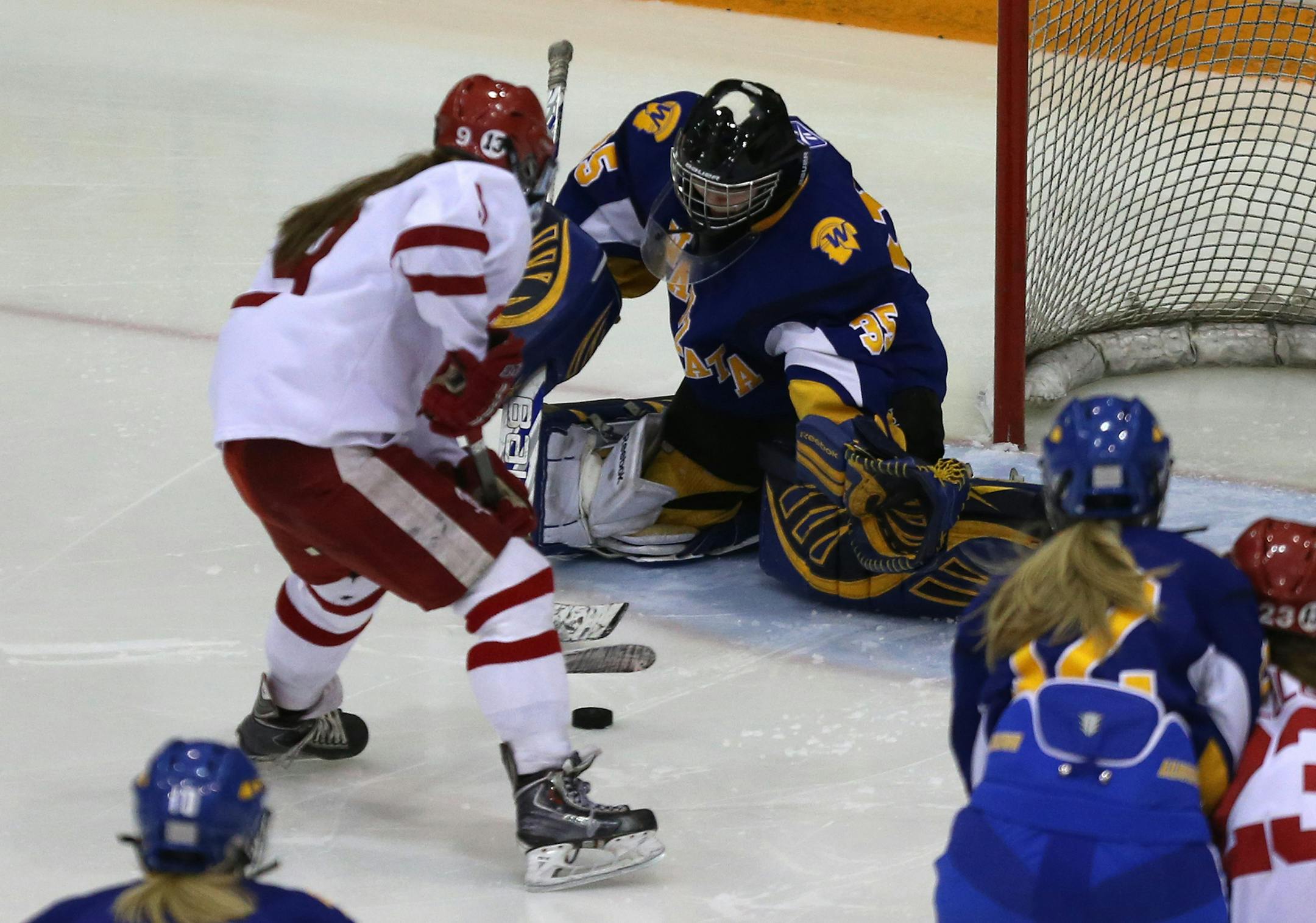 Benilde-St. Margaret Caitlin Reilly scored on Wayzata's Paige Marcy during the third period in the 6AA Section finals at Ridder Arena in Minneapolis Friday, February 14, 2014. Benilde-St. Margaret won over Wayzata 3-2. ] (KYNDELL HARKNESS/STAR TRIBUNE) kyndell.harkness@startribune.com