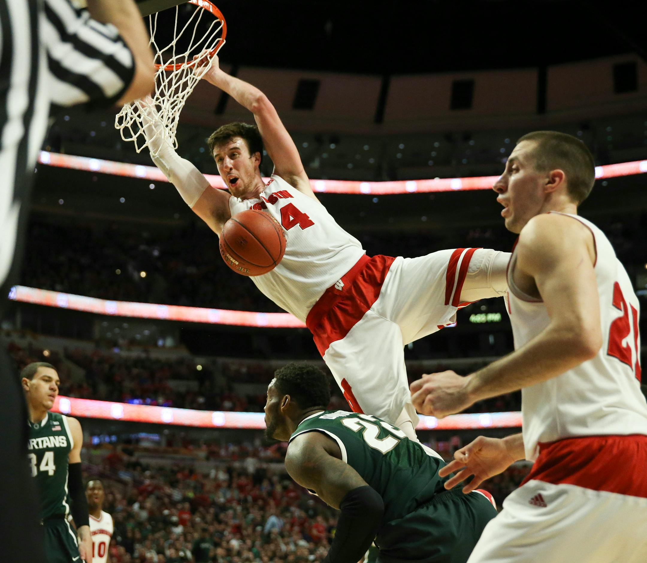 Wisconsin forward Frank Kaminsky (44) dunks over Michigan State guard/forward Branden Dawson (22) during the second half of the Big Ten Men's Tournament championship game on Sunday, March 15, 2015, at the United Center in Chicago. (Nuccio DiNuzzo/Chicago Tribune/TNS) ORG XMIT: 1165301