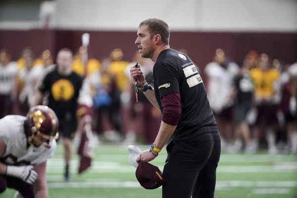 New offensive coordinator Mike Sanford Jr. during a Gophers spring football practice last month before the program was shut down.