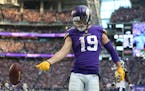 Minnesota Vikings wide receiver Adam Thielen (19) flipped the ball after scoring on a 65 yard catch in the fourth quarter at U.S. Bank Stadium Sunday 