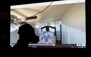 Medical school liaison librarian Ryn Gagen uses a virtual reality headset to experience what it's like to die at the University of Minnesota Health Sc