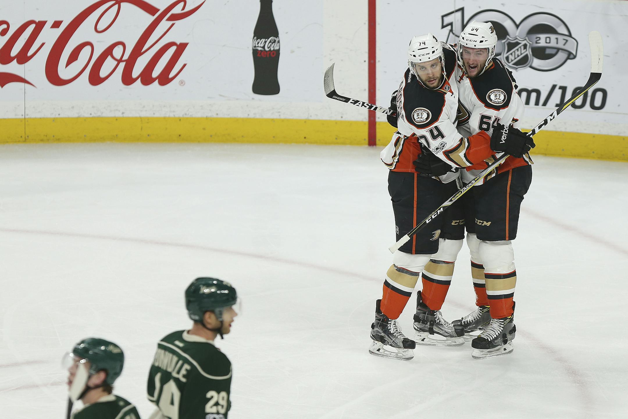 Anaheim Ducks Joseph Cramarossa, top left, celebrates with teammate Stefan Noesen, right, after Noesen scored the team's first goal against the Minnesota Wild in the first period of an NHL hockey game Saturday, Jan. 21, 2017, in St. Paul, Minn. (AP Photo/Stacy Bengs)