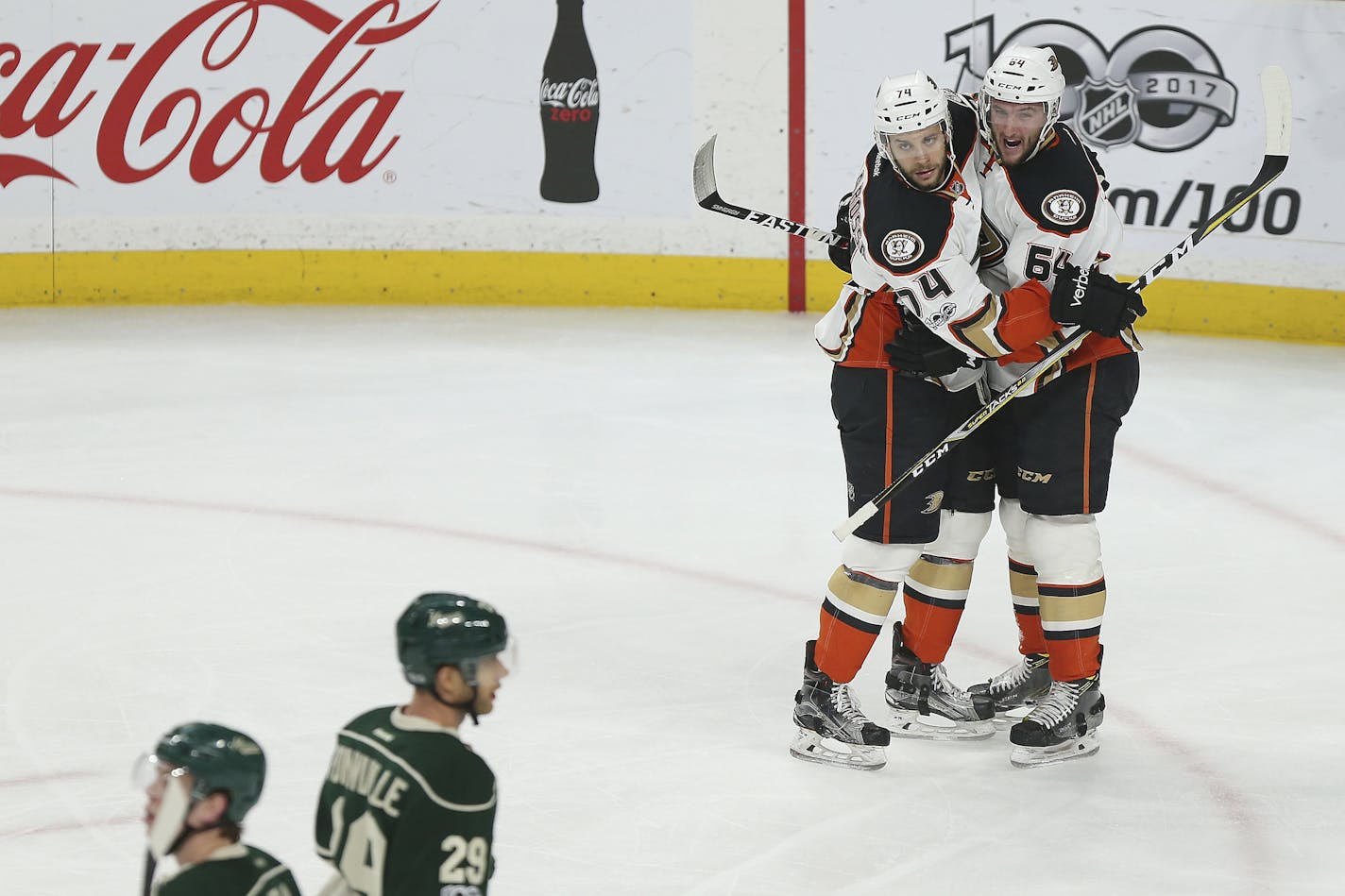 Anaheim Ducks Joseph Cramarossa, top left, celebrates with teammate Stefan Noesen, right, after Noesen scored the team's first goal against the Minnesota Wild in the first period of an NHL hockey game Saturday, Jan. 21, 2017, in St. Paul, Minn. (AP Photo/Stacy Bengs)