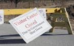 Signs announce the visitor center at the DeSoto National Wildlife Refuge in Missouri Valley, Iowa, is closed, Friday, Jan. 4, 2019, as the partial gov