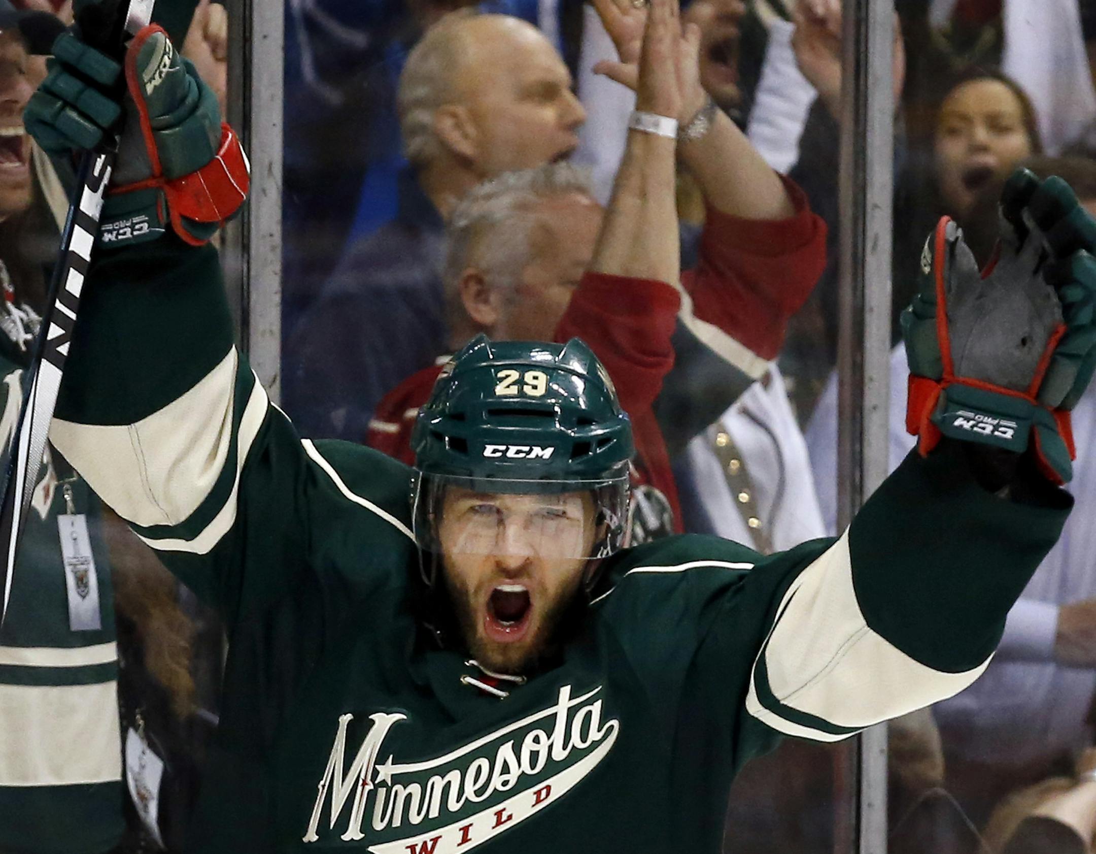 Jason Pominville (29) celebrated a goal by Mikael Granlund (64) in the third period. ] CARLOS GONZALEZ cgonzalez@startribune.com - May 6, 2014, St. Paul, Minn., Xcel Energy Center, NHL, Minnesota Wild vs. Chicago Blackhawks, Stanley Cup Playoffs Round 2, Game 3 ORG XMIT: MIN1405062309246257