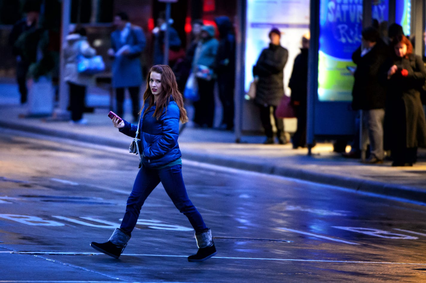 Pedestrians in downtown Minneapolis are guided or cautioned by a cacophony of disembodied voices.