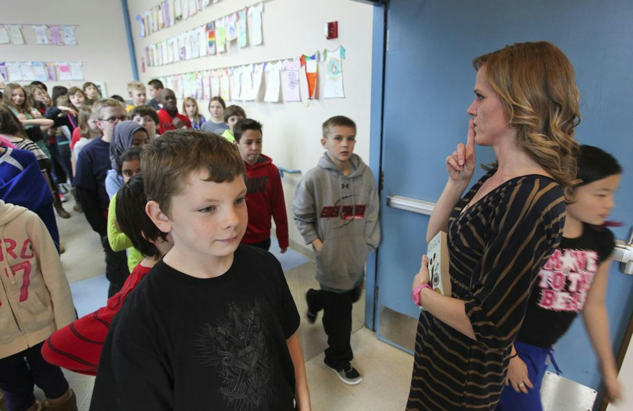 Dawn Johnson watched her fifth-grade students Thursday at Clear Springs Elementary in Minnetonka. Johnson is among a small number of certified teachers.