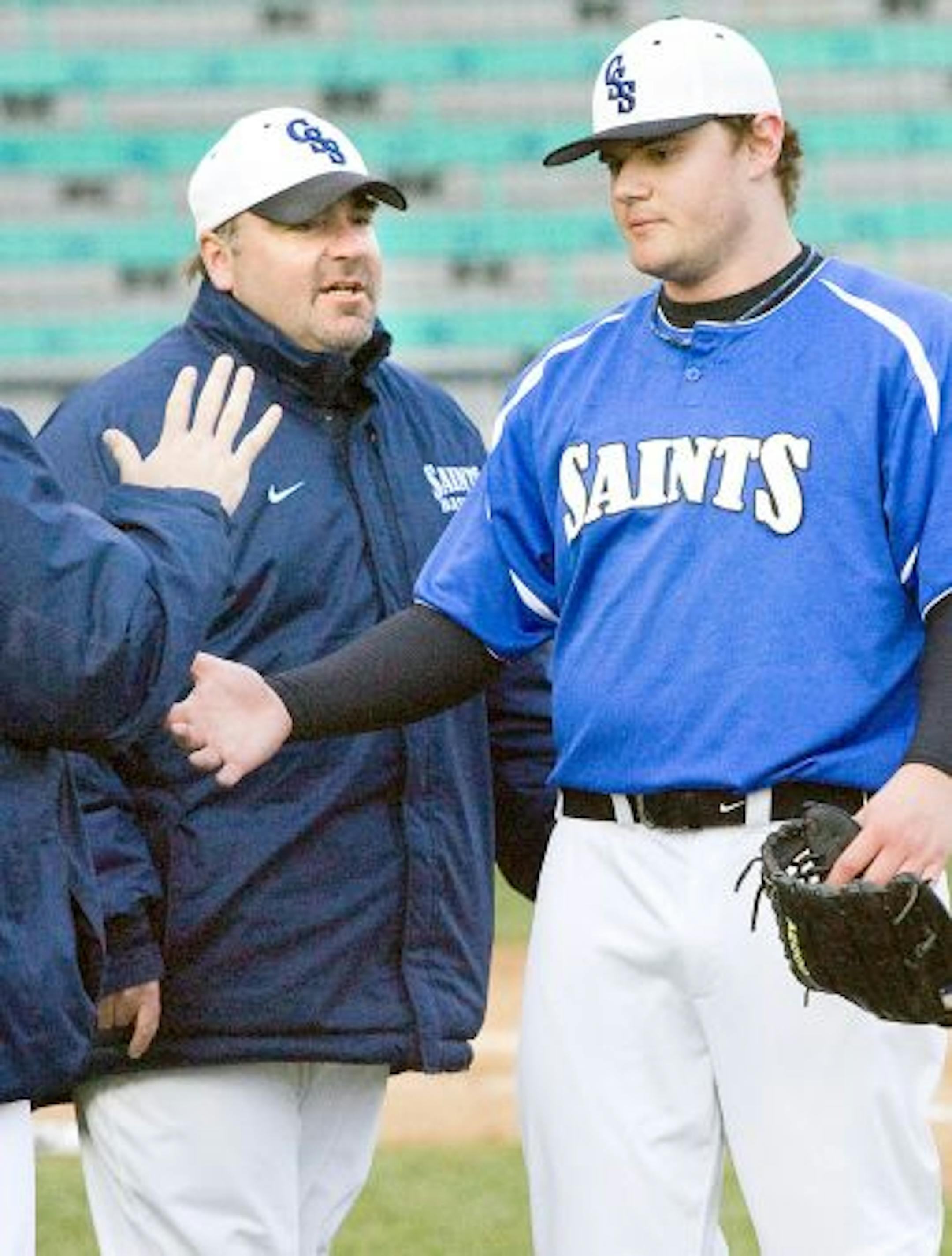 St. Scholastica baseball coach John Baggs (left), who died last week of cancer at age 43, took a struggling Division III program and led it to national prominence.