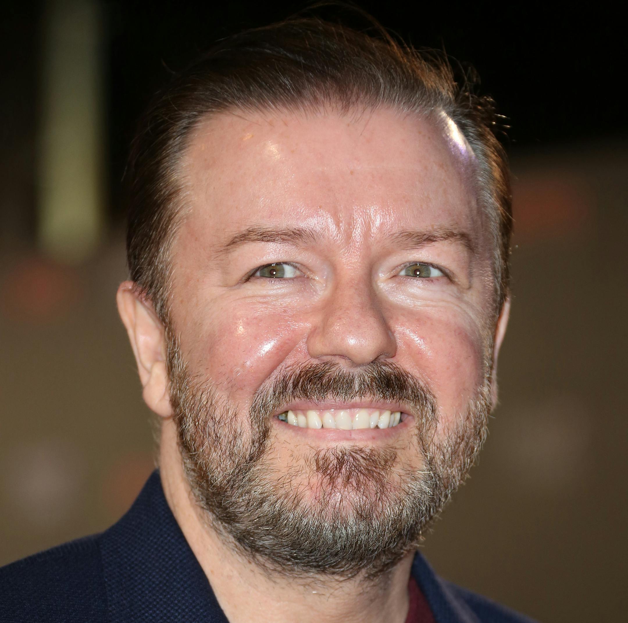 FILE - In this Feb. 26, 2015 file photo, Ricky Gervais poses for photographers upon arrival at the House of Cards season 3 World Premiere at the Empire Cinema in central London. 2015 Emmy nominees all have their favorite shows, and some have imagined what it might be like to hang out in one of the alluring worlds of the small screen. ìOK, ëGame of Thrones.í Oh my God. Give me a sword. Give me a sword and a dragon. I will sort out some stuff in that fictional world.î said Gerv
