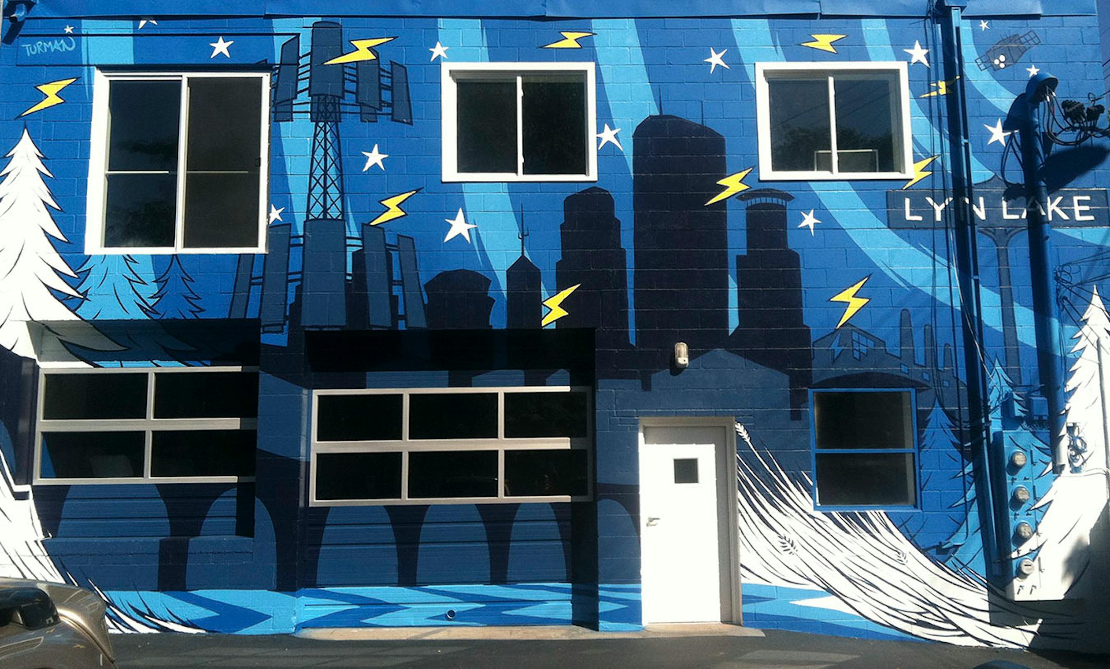 The everywhere artist, Adam Turman, His clean, dynamic murals crawl up the sides of breweries, in elementary schools, the lobby of downtown Minneapolis' hip, new hotel. He boasts T-shirts and pint glasses and posters. He's even created a jigsaw puzzle.