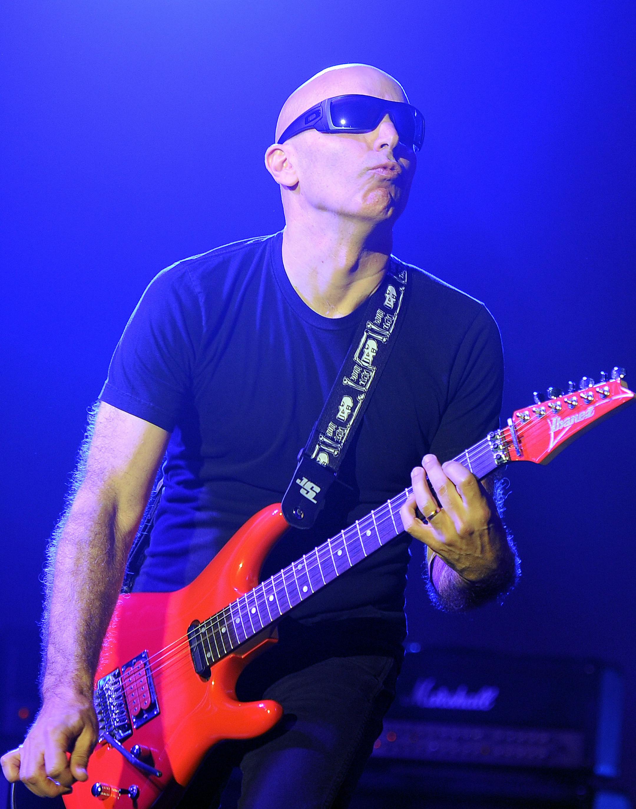 Joe Satriani performs at the Parker Playhouse on September 12, 2013 in Ft Lauderdale ,Florida (Photo by Jeff Daly/Invision/AP) ORG XMIT: T