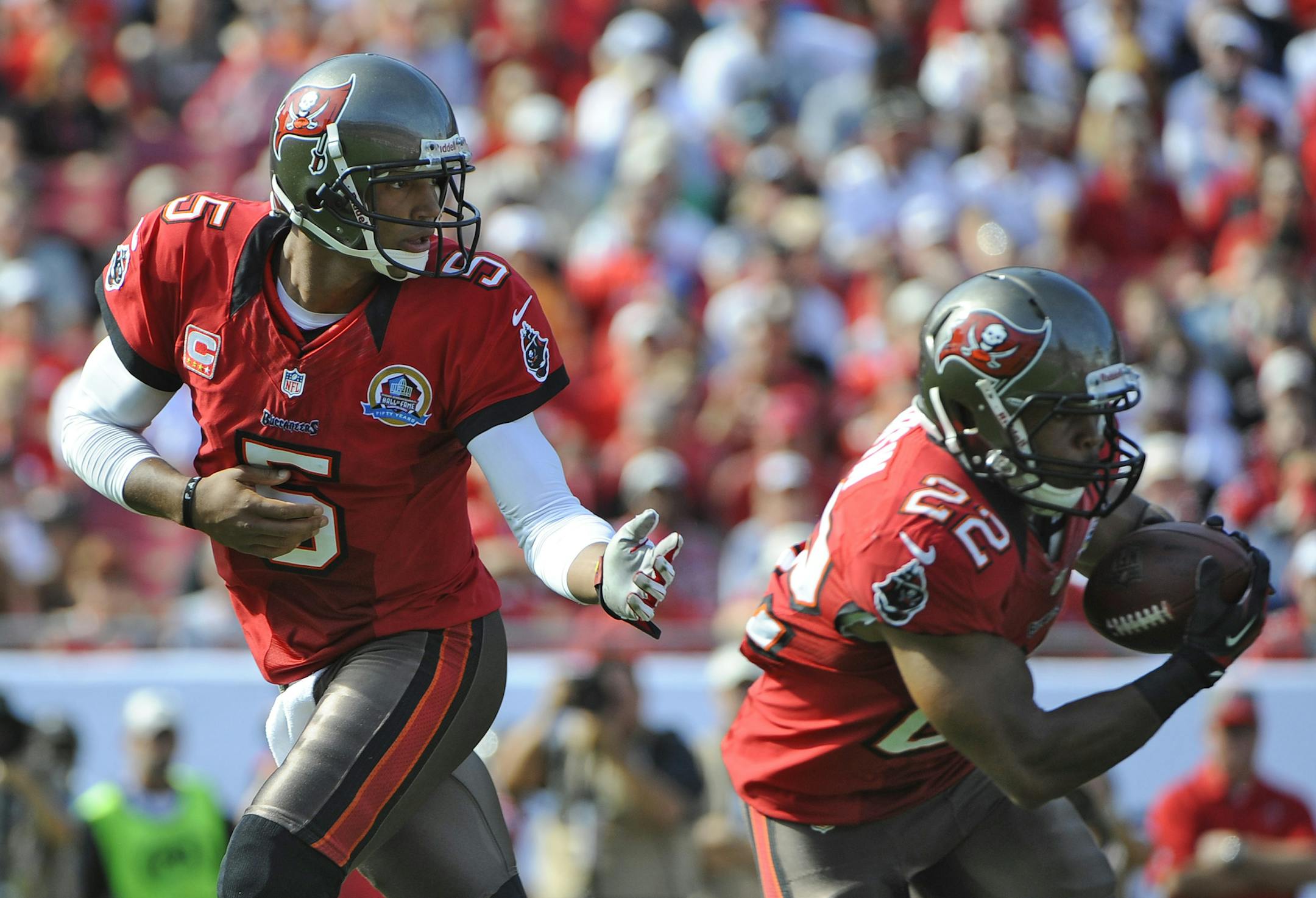 Tampa Bay Buccaneers quarterback Josh Freeman (5) hands the ball off to Tampa Bay Buccaneers running back Doug Martin (22) against the Philadelphia Eagles during the first quarter of an NFL football game Sunday, Dec. 9, 2012, in Tampa, Fla. (AP Photo/Brian Blanco) ORG XMIT: NYOTK