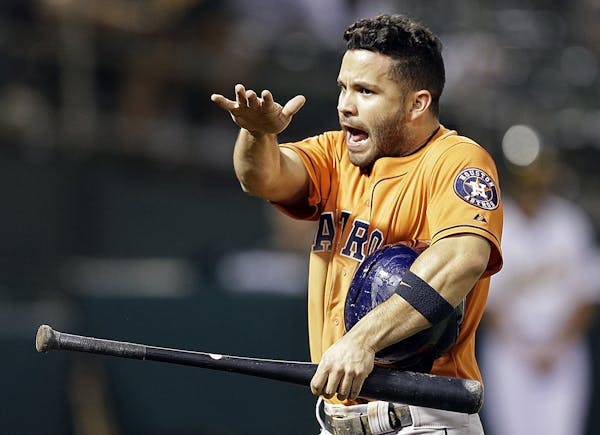 Houston Astros' Jose Altuve celebrates after scoring against the Oakland Athletics in the tenth inning of a baseball game Thursday, Aug. 6, 2015, in O