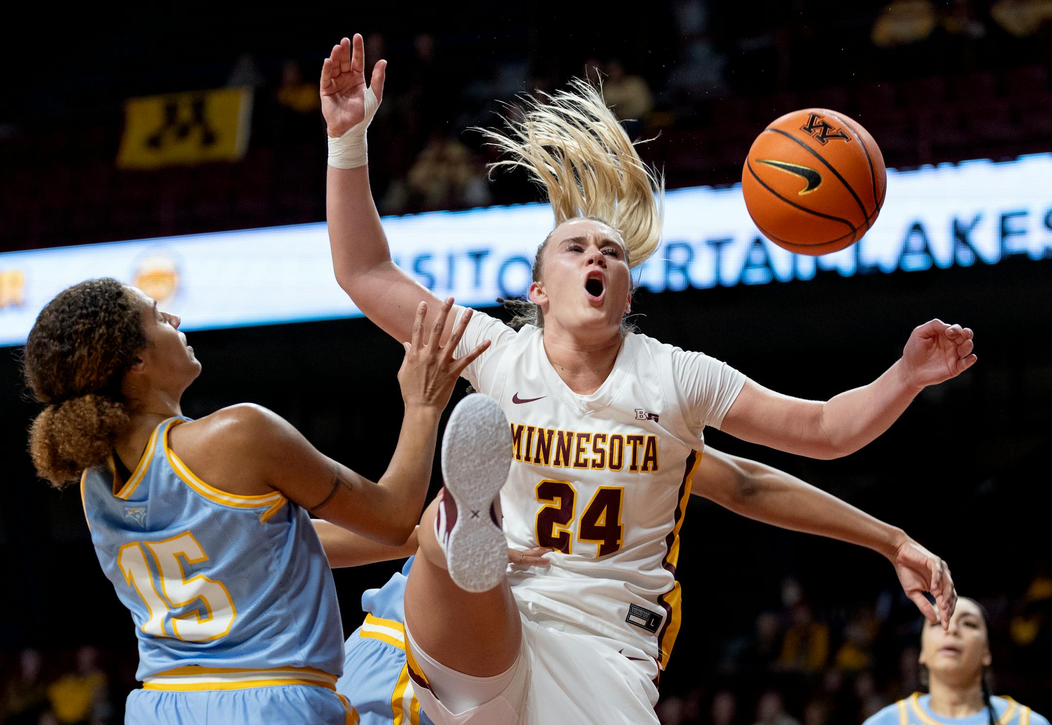 Mallory Heyer (24) of Minnesota is defended by Nigeria Harkless (15) of Long Island in the first quarter Wednesday, November 8, 2023, at Williams Arena in Minneapolis, Minn. ] CARLOS GONZALEZ • carlos.gonzalez@startribune.com