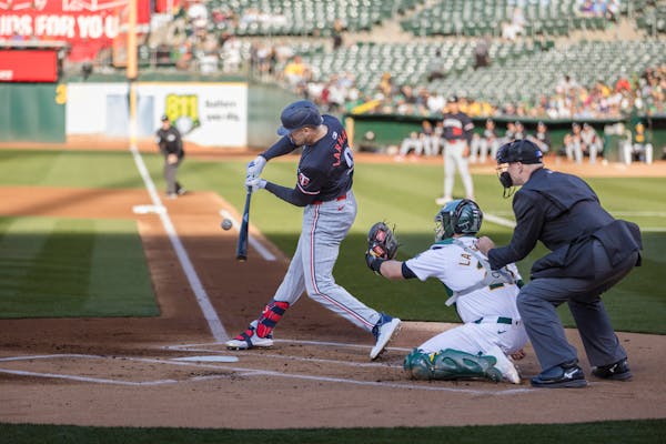 The Twins' Trevor Larnach hits an RBI single on Friday in his first game at the Oakland Coliseum, despite growing up nearby.