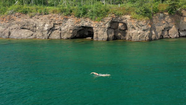 Karen Zemlin of Plymouth practices her swim route on Lake Superior south of Split Rock Lighthouse this month. 
