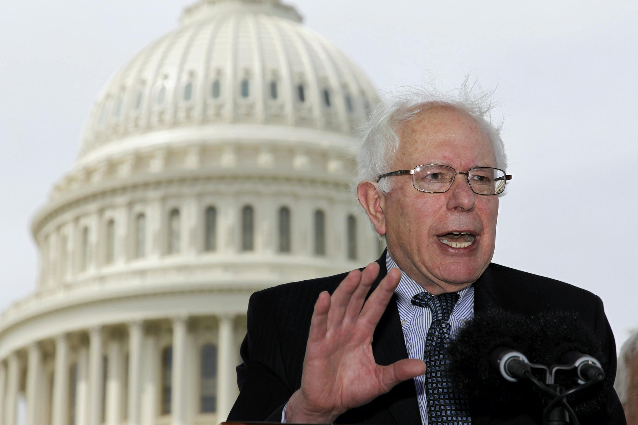 FILE - In this May 10, 2011, file photo Sen. Bernie Sanders, I-Vt., gestures during a news conference on Capitol Hill in Washington to discuss single-payer health care bills in the Senate and House. In In 2016 Democratic presidential candidate Sanders says his plan for a government-run health care system from cradle to grave is like Medicare for all. But with full coverage for long-term care, most dental care included, no deductibles and zero copays, the Sanders plan is considerably more generou