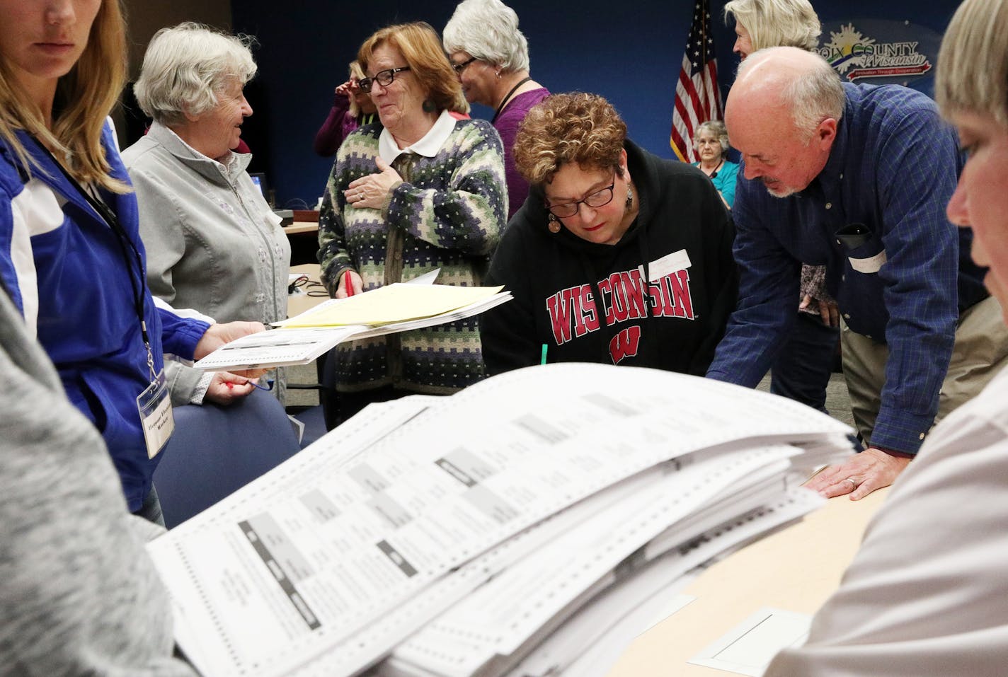 Recount workers sort ballots during the presidential recount Thursday morning in Hudson, Wis.