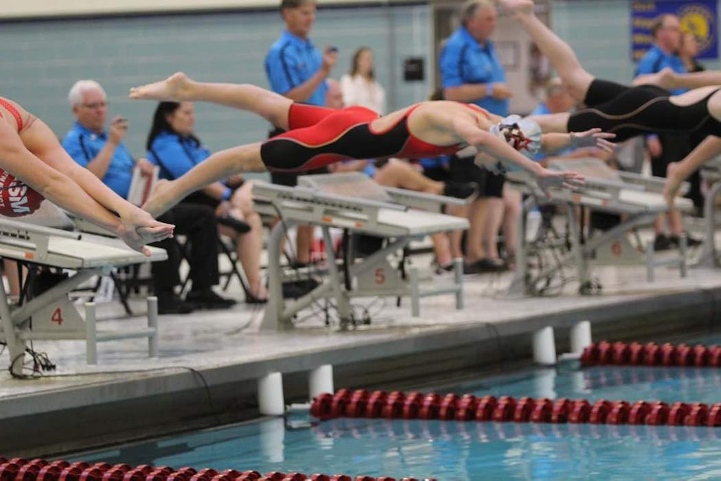 The rush to two state championships began with a dive Friday for Monticello eighth-grader Adalynn Biegler.