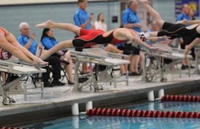 The rush to two state championships began with a dive Friday for Monticello eighth-grader Adalynn Biegler.