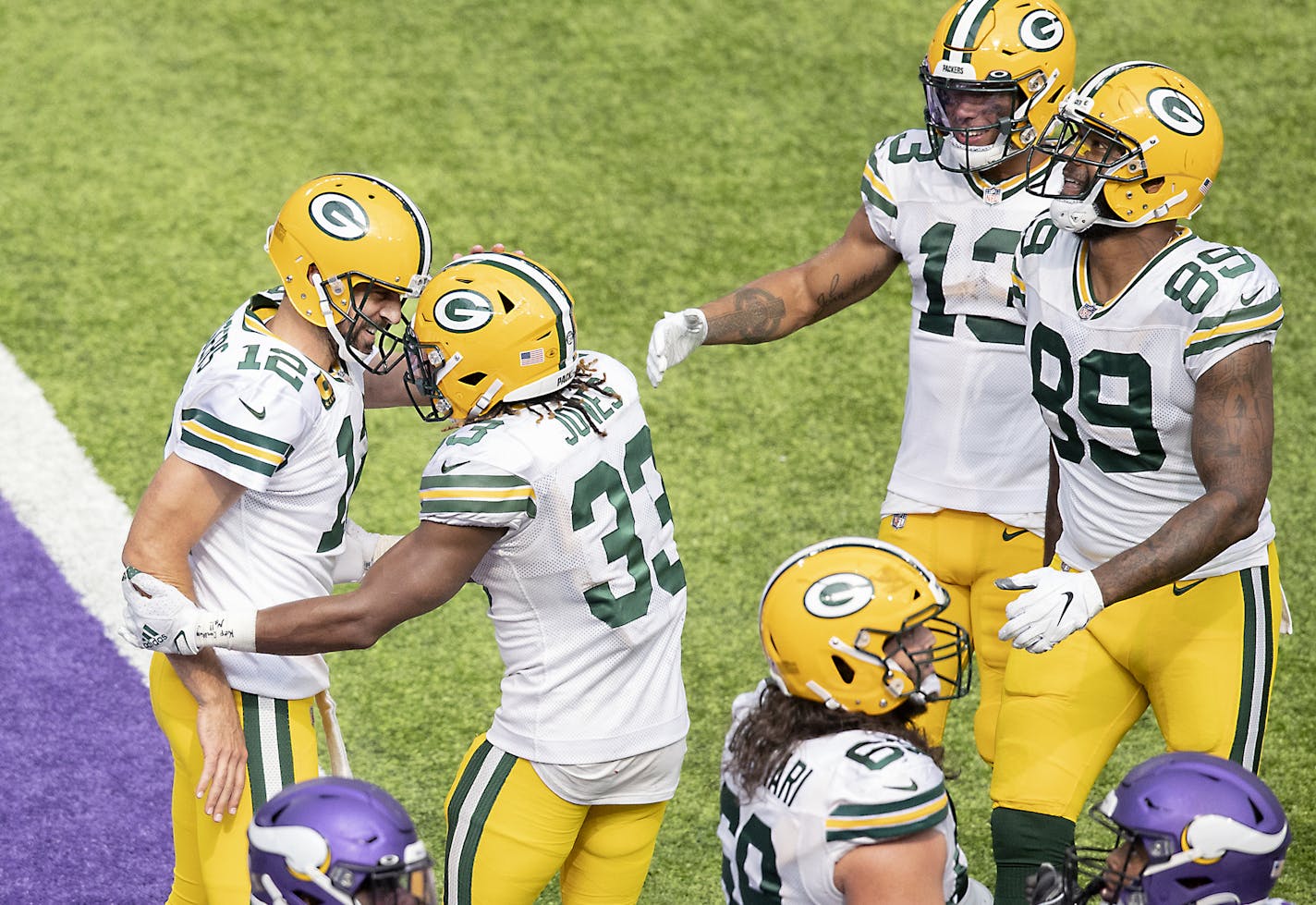 Green Bay Packers quarterback Aaron Rodgers, left, celebrated a touchdown with Green Bay Packers running back Aaron Jones during the fourth quarter.