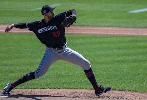 Minnesota Twins starting pitcher Pablo López (49) threw a pitch in the first inning.