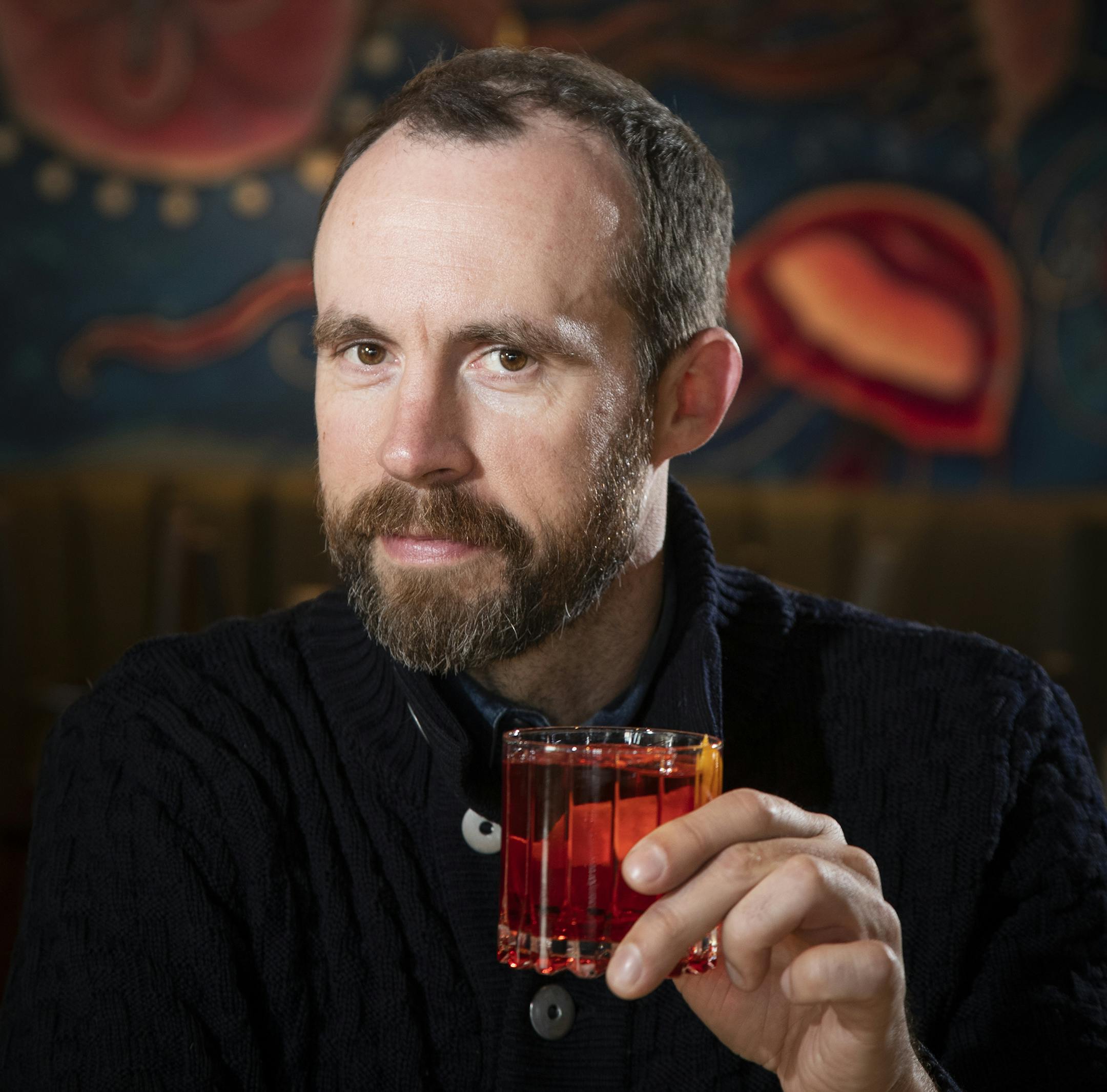 Erik Eastman poses for a photo at Octo Fishbar. ] LEILA NAVIDI ¥ leila.navidi@startribune.com BACKGROUND INFORMATION: Erik Eastman, the director of sales at Minnesota Ice and owner of Easy & Co. cocktail consulting firm, poses for a photo with a Negroni cocktail at Octo Fishbar in St. Paul on Friday, January 11, 2019.