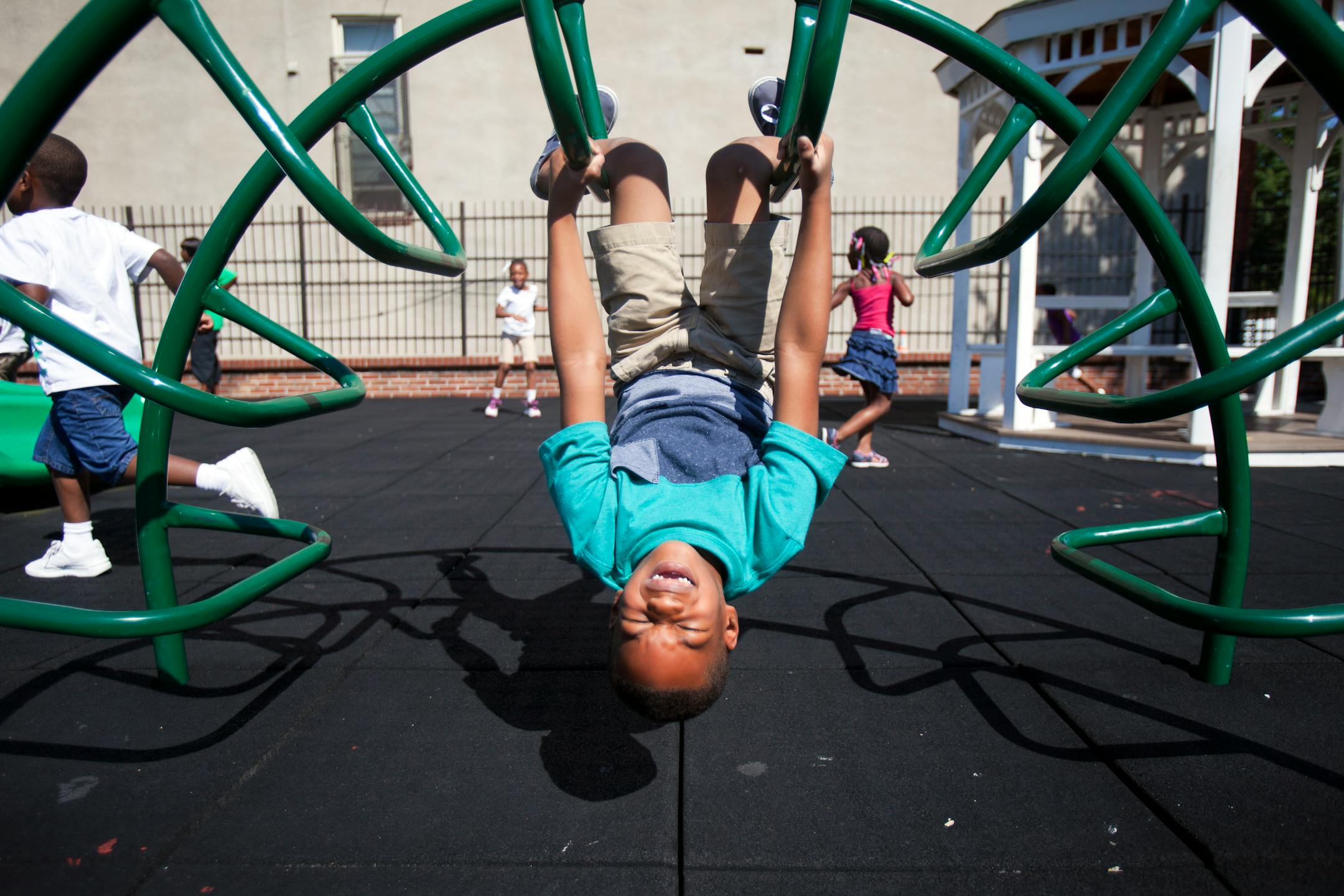 Mehki Lee, 5, plays on the playground at Union Baptist-Harvey Johnson Head Start summer camp in Baltimore, Aug. 5, 2013. The obesity rate among young children from poor families fell in 19 states and U.S. territories in recent years, federal health officials said Tuesday, the first major government report showing a consistent pattern of decline for low-income children.