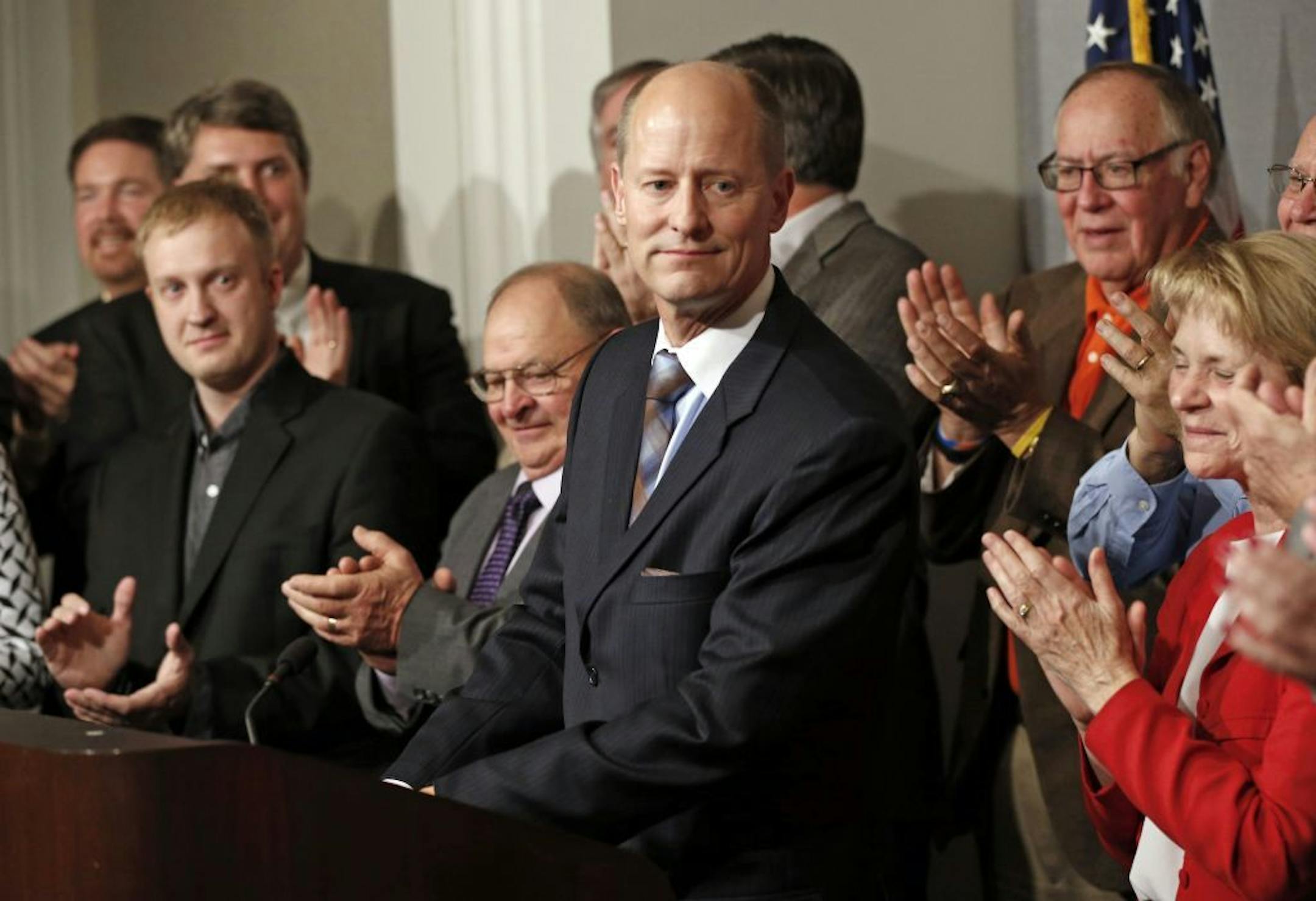 State Senate Majority Leader Paul Gazelka, center, is applauded by his fellow Republican Senate members, as he prepares to address the media after he was elected, Thursday, Nov. 10, 2016, at the State Capitol in St. Paul, Minn.