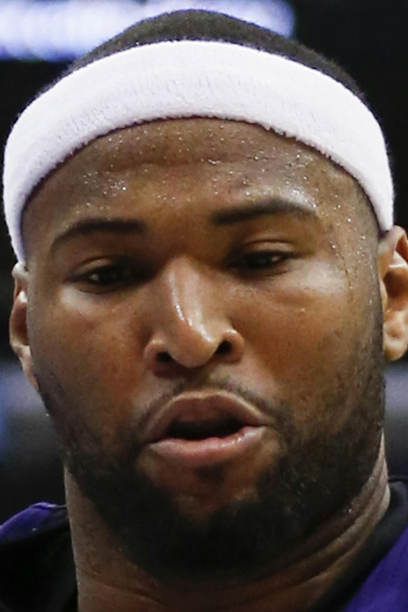 Sacramento Kings center DeMarcus Cousins reaches for the ball in front of Los Angeles Clippers guard J.J. Redick during the second half of an NBA basketball game in Los Angeles, Saturday, April 12, 2014. The Clippers won 117-101. (AP Photo/Danny Moloshok)