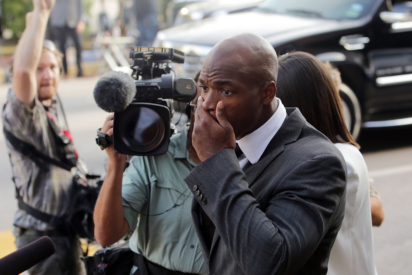 FILE - In this Oct. 8, 2014, file photo, Minnesota Vikings running back Adrian Peterson arrives at court in Conroe, Texas. The NFL suspended Adrian Peterson without pay for at least the remainder of the season. The league said Tuesday, Nov. 18, 2014, it informed the Minnesota Vikings running back he will not be considered for reinstatement before April 15 for violating the NFL personal conduct policy. (AP Photo/Houston Chronicle, Billy Smith II, File)