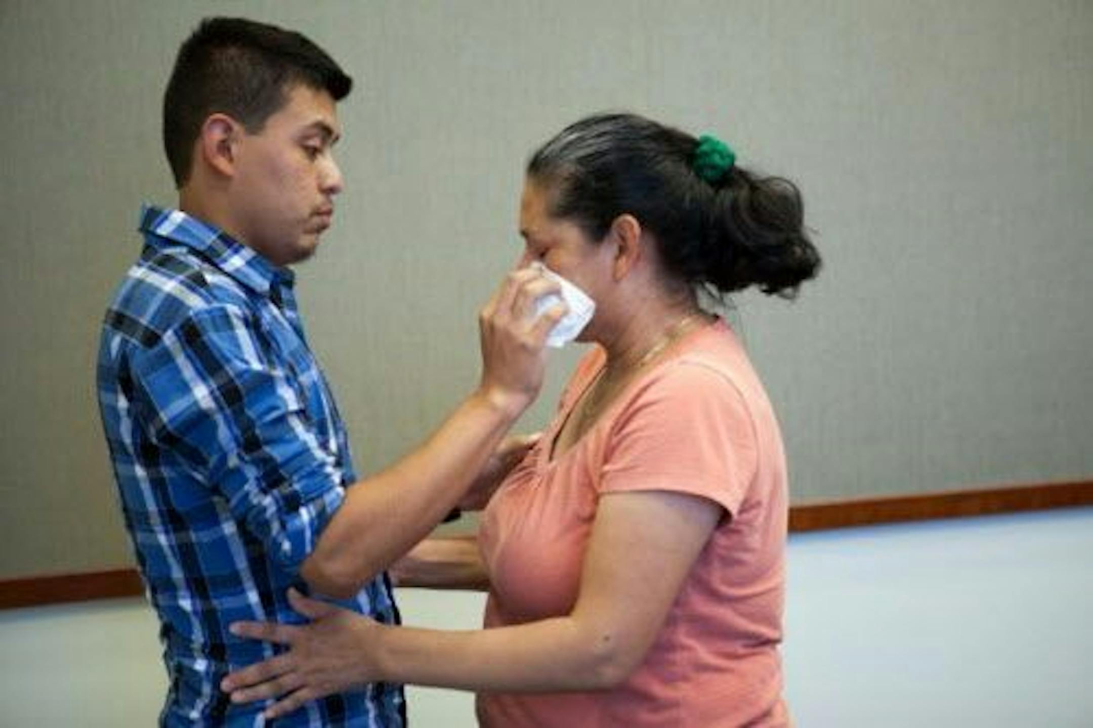 Steve Hernandez wipes a tear from his mother's eye after seeing her for the first time in 20 years in San Diego, Calif., on Thursday, June 9, 2016. Steve Hernandez was abducted by his father Valentin Hernandez from their Rancho Cucamonga residence in 1995 when he was 18-months-old. Since that time, 42-year-old Maria Mancia had searched for her son to no avail. The boy, Steve Hernandez, now a man of about 22, has been found in Mexico. On Thursday he was brought to the U.S. to meet his mother.Auth