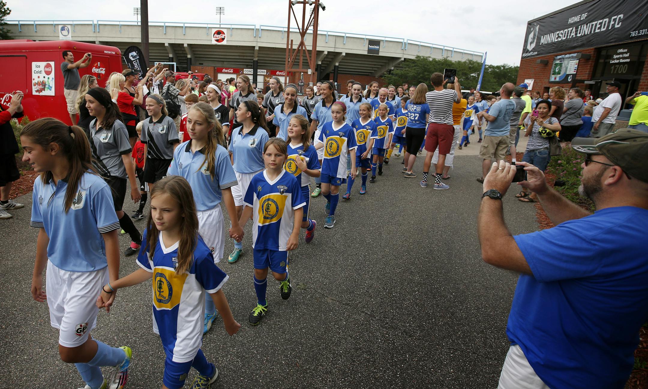 Players walked out before a soccer game between Centennial Soccer Club and Lakes United Futbol Club on Thursday evening at the National Sports Center in Blaine. ] CARLOS GONZALEZ cgonzalez@startribune.com - June 26, 2014 , Blaine, Minn., The National Sports Center in Blaine, There is supposed to be a flash mob of fans for a youth soccer game Thursday at 6 30 p.m. The teams Centennial Soccer Club (Lino Lakes, MN) and Lakes United Futbol Club (Forest Lake, MN).