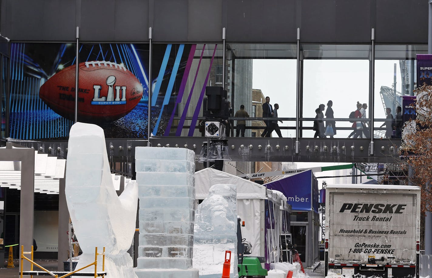 Crowds use the skyway system on the Nicollet Mall in Minneapolis where Super Bowl Live is set up. (AP Photo/Jim Mone)