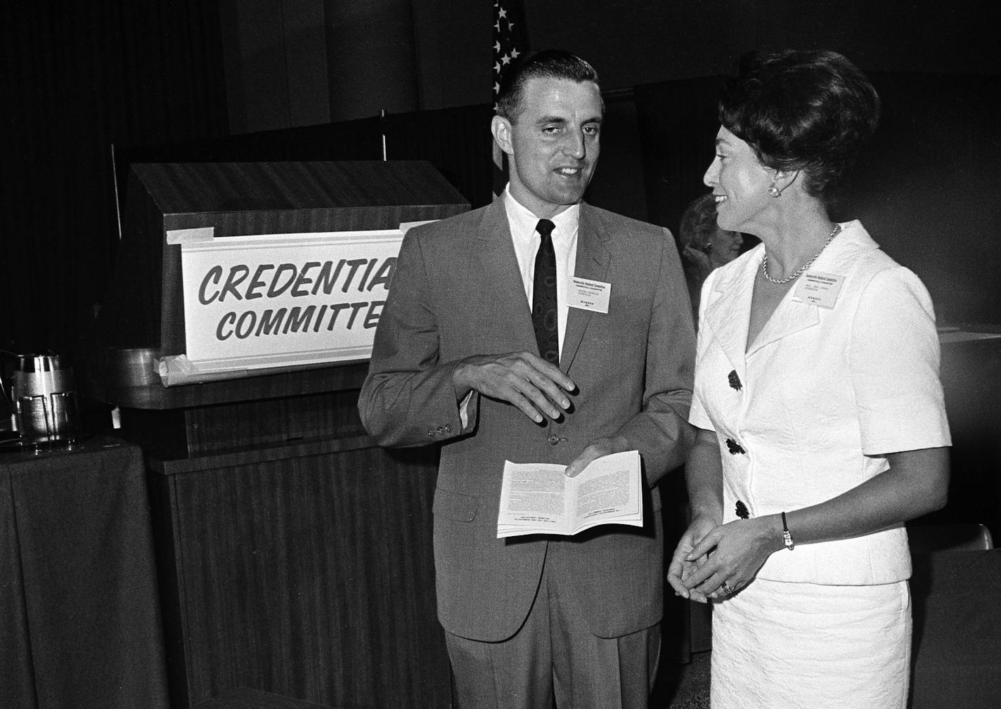 Walter Mondale, left, Minnesota Attorney General, and Mrs. Burton Joseph, National Committeewoman from Minnesota appear at a meeting of the Democratic Credentials Committee, of which both are members, at the Atlantic New Jersey, Convention Hall, Aug. 22, 1964. (AP Photo) ORG XMIT: APHS451216