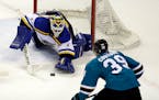 Blues goalie Brian Elliott will try to hold off Logan Couture and the hard-charging Sharks in the Western Conference finals. Game 1 is Sunday night in