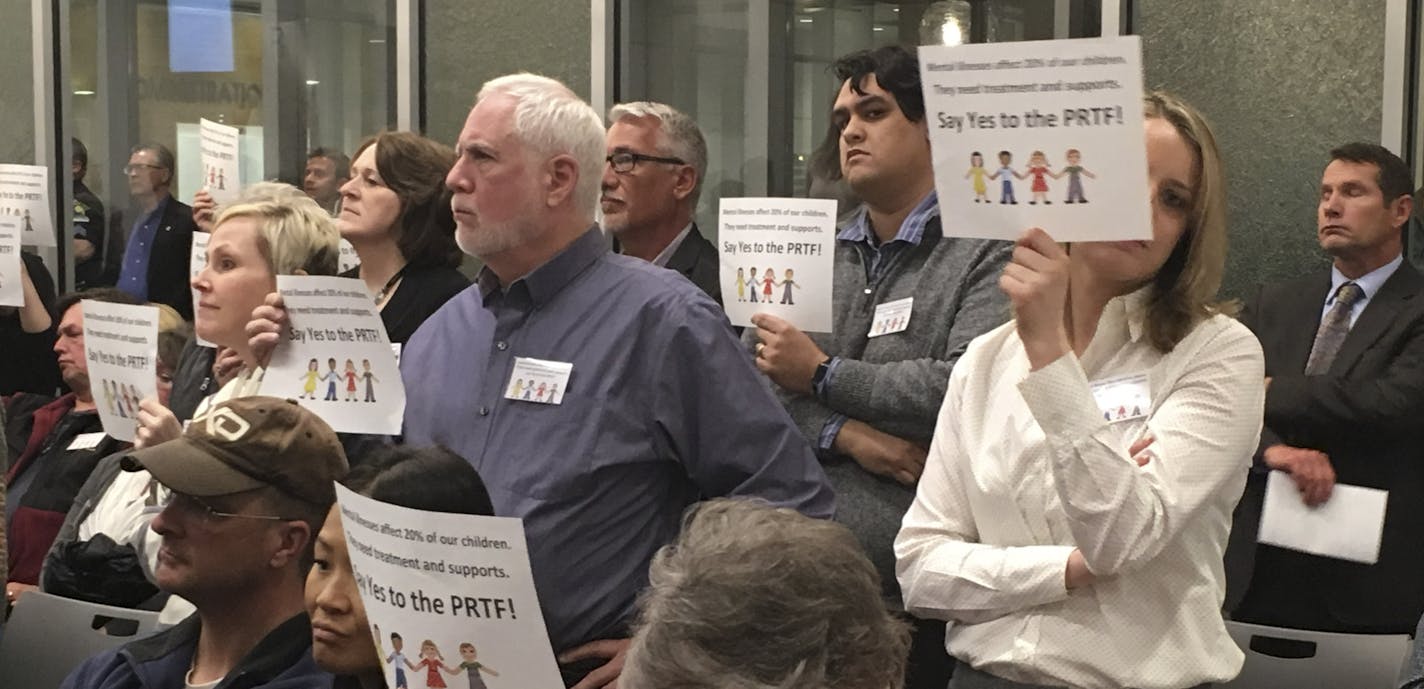 Angry residents of Forest Lake held up placards and some yelled, "Shame on you!" after city councilors voted to reject a psychiatric residential facility for children and adolescents.