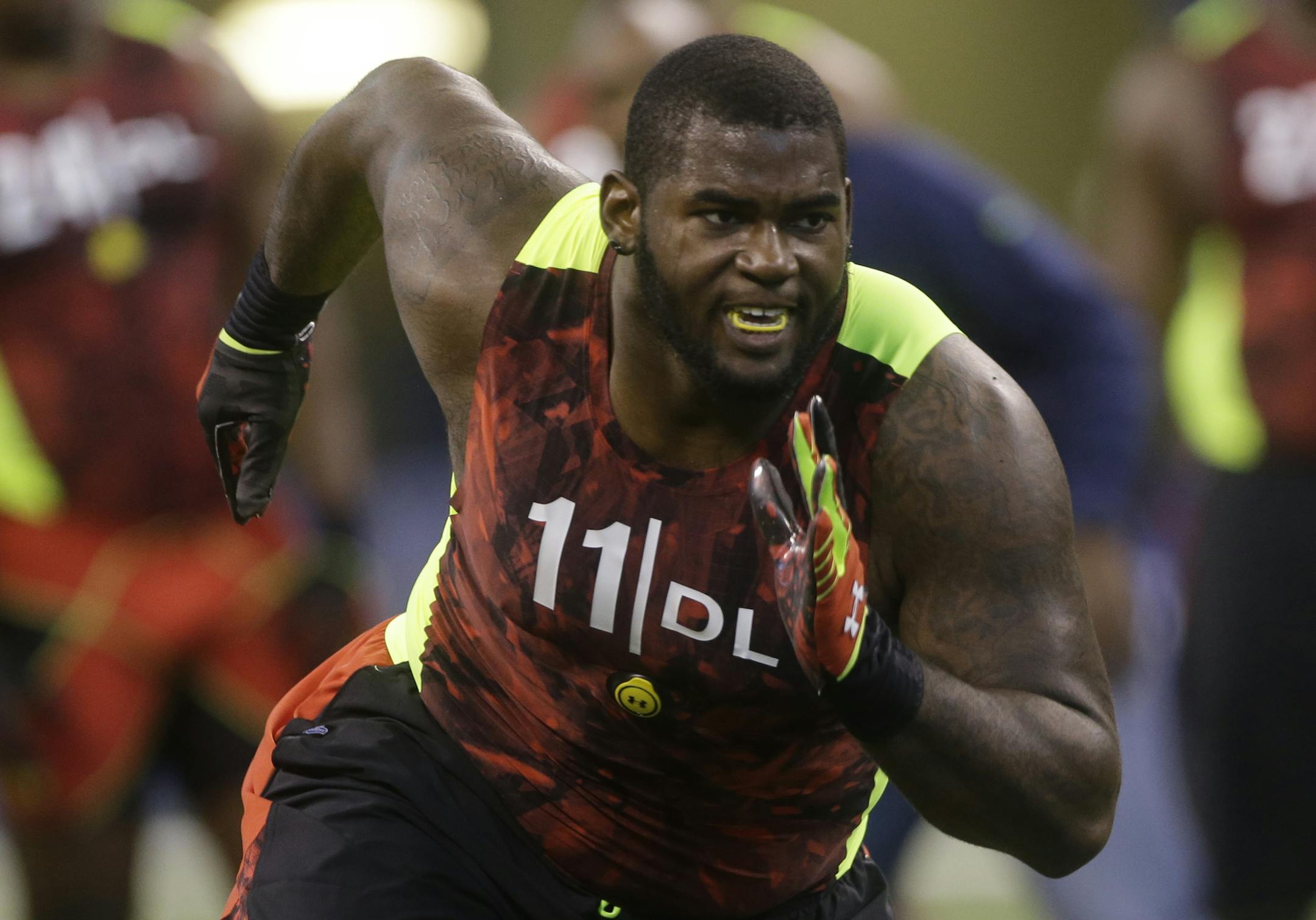 FILE - In this Feb. 25, 2013 file photo, Florida defensive lineman Sharrif Floyd runs a drill during the NFL football scouting combine in Indianapolis. Floyd is a possible first round pick in the NFL Draft on Thursday, April 25, 2013. (AP Photo/Dave Martin, File)