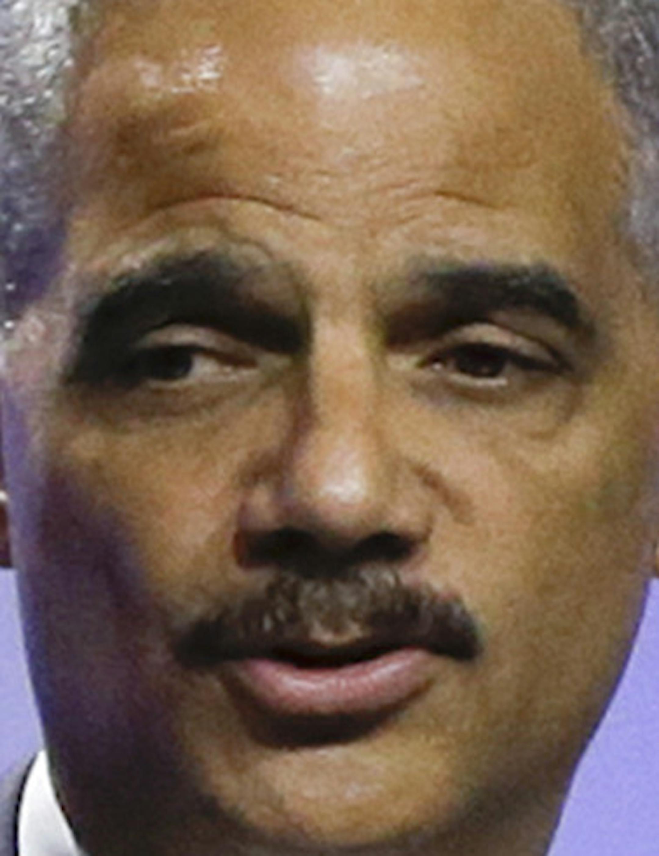 Attorney General Eric Holder delivers the keynote address at the annual NAACP convention, Tuesday, July 16, 2013, in Orlando, Fla. (AP Photo/John Raoux)